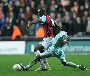 Images Dated 19th November 2011: Gael Bigirimana vs. Carlton Cole: Intense Tackle in Coventry City vs