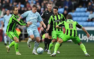 Images Dated 2011 December: Gary Deegan's Determined Attempt to Penetrate Brighton's Defence in Coventry City vs Brighton Npower