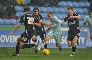 Images Dated 4th February 2012: Gary McSheffrey Attempts to Breach Ipswich's Defense in Coventry City's Championship Clash