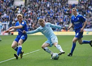 Images Dated 10th March 2012: Gary McSheffrey vs Burke and Ramage: Intense Clash Between Coventry City