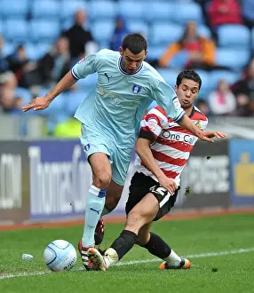 21-04-2012 V Doncaster Rovers, Ricoh Arena Prints: Intense Battle: Conor Thomas vs Fabien Robert in Coventry City vs Doncaster Rovers Championship Clash (April 2012)
