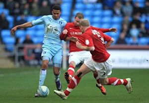 Images Dated 25th February 2012: Intense Championship Showdown: Cyrus Christie vs. Barnsley's Done and McEveley