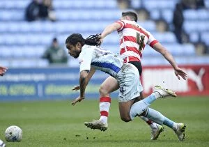 Images Dated 21st March 2015: Intense Clash: Dean Furman vs. Dominic Samuel - Coventry City vs Doncaster Rovers