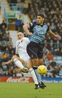 Images Dated 10th January 2004: Intense Midfield Battle: Youssef Safri vs. Gavin Mahon (Coventry City vs)