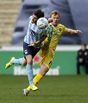 Intense Moment: Coventry City vs Millwall - Clash Between Romain Vincelot and Chris Taylor at Ricoh Arena