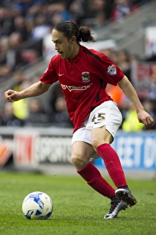 Intense Moment: Jodi Jones of Coventry City Faces Off in Sky Bet League One Clash at Wigan Athletic's DW Stadium