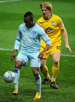 Images Dated 6th March 2012: Intense Rivalry: Alex Nimely vs. Paul McShane in Coventry City vs