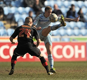 Images Dated 2013 April: Intense Rivalry: Baker vs. Bidwell in Coventry City vs. Brentford Football Match