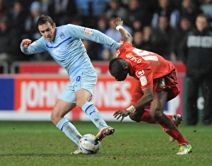 Images Dated 2013 February: Intense Rivalry: Blair Adams vs Abdul Osman - Coventry City vs Crewe Alexandra (Johnstones Paint Trophy Northern Final)