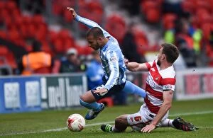 Images Dated 23rd April 2016: Intense Rivalry: Butler vs. Tudgay Clash at Keepmoat Stadium (Doncaster Rovers vs)