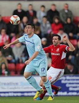 Images Dated 13th October 2012: Intense Rivalry: Callum Ball vs. Tommy Miller - A Battle at the County Ground (Swindon Town vs)