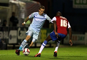 Images Dated 2012 October: Intense Rivalry: Carl Baker vs Jamal Fyfield in the Johnstones Paint Trophy Northern Section Clash between Coventry