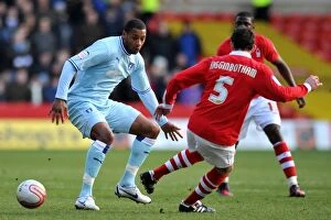 Images Dated 18th February 2012: Intense Rivalry: Clive Platt vs. Danny Higginbotham's Battle for Supremacy in Coventry City vs