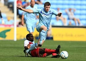 Images Dated 9th September 2012: Intense Rivalry: Coventry City vs Stevenage in Npower League One at Ricoh Arena