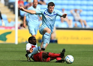 Coventry City V Stevenage : Ricoh Arena : 09-09-2012 Prints: Intense Rivalry: Coventry City vs Stevenage in Npower League One at Ricoh Arena