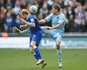 Images Dated 10th March 2012: Intense Rivalry: Cranie vs Burke at the Ricoh Arena (Npower Championship, 10-03-2012)