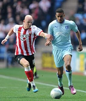 Images Dated 5th November 2011: Intense Rivalry: Cyrus Christie vs. Richard Chaplow - Coventry City vs