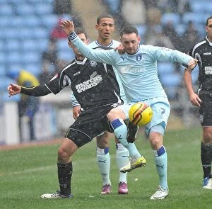 Images Dated 4th February 2012: Intense Rivalry: David Bell vs Daryl Murphy Battle for Ball Supremacy in Coventry City vs Ipswich