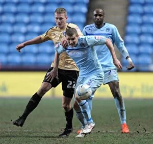 Images Dated 2nd January 2007: Intense Rivalry: Dickinson vs. Smith - Coventry City vs. Colchester United (2013)