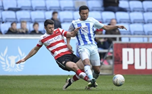 Images Dated 2015 March: Intense Rivalry: Enda Stevens vs Grant Ward Clash in Coventry City vs Doncaster Rovers League One Match