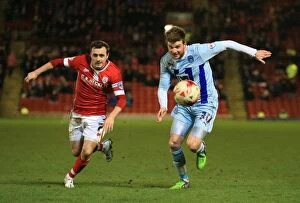 Sky Bet League One - Barnsley v Coventry City - Oakwell Collection: Intense Rivalry: A Football Battle - Scowen vs Stokes (Sky Bet League One)