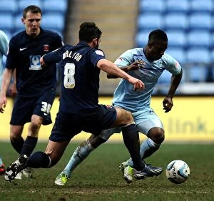 Images Dated 16th March 2013: Intense Rivalry: Franck Moussa vs. Simon Walton - Coventry City vs