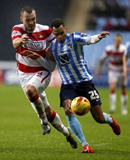 Images Dated 2015 November: Intense Rivalry: Jacob Murphy vs Luke McCullough in Coventry City's Sky Bet League One Clash against Doncaster