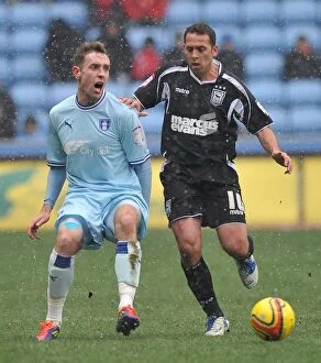 Images Dated 4th February 2012: Intense Rivalry: Keogh vs. Chopra Clash in Coventry City vs. Ipswich Town Npower Championship