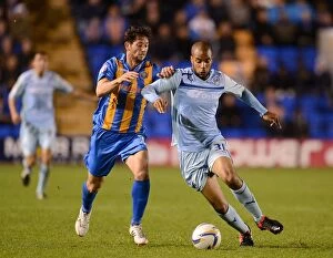 Shrewsbury Town v Coventry City - Greenhous Meadow : 18-09-2012 Collection: Intense Rivalry: McGoldrick vs Jacobson's Battle for Ball in Coventry City's Npower League One Clash
