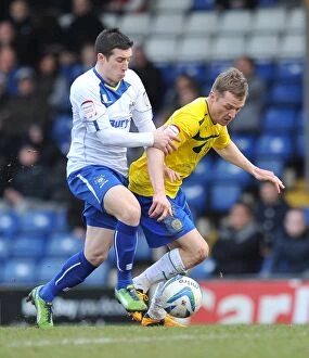 Images Dated 16th February 2013: Intense Rivalry: McSheffrey vs Jones Clash in Coventry City's Npower League One Match at Gigg Lane