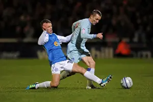 Images Dated 2011 December: Intense Rivalry: McSheffrey vs Kennedy - Coventry City vs Peterborough United (Npower Championship)