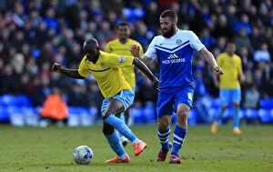 Sky Bet League One - Peterborough United v Coventry City - London Road Collection: Intense Rivalry: Odelusi vs Bostwick's Battle for Ball Supremacy in Coventry City's Sky Bet League