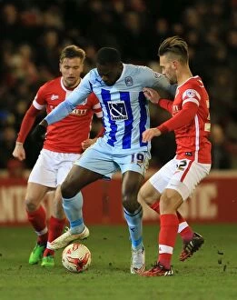 Images Dated 3rd March 2015: Intense Rivalry: Waring, Bailey vs Nouble - A Football Battle: Barnsley vs Coventry City