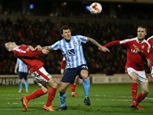 Sky Bet League One - Barnsley v Coventry City - Oakwell Collection: Intense Rivalry: Williams vs Henderson in Barnsley vs Coventry City Football Showdown