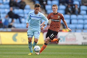 Images Dated 20th October 2012: James Bailey Evasive Move Against Jeff Hughes in Coventry City vs Notts County Npower League One Clash at Ricoh Arena