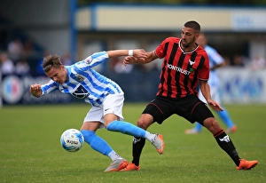 James Maddison Evasively Dodges Liam Secombe's Tackle in Coventry City's Pre-Season Friendly against Oxford United
