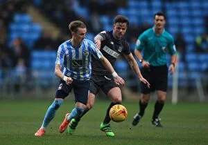 Images Dated 13th February 2016: James Maddison Stands Firm Against Joe Riley in Intense Sky Bet League One Rivalry at Ricoh Arena