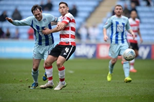 Images Dated 2015 March: Jim O'Brien vs Dean Furman: A Battle in Sky Bet League One - Coventry City vs Doncaster Rovers at Ricoh Arena