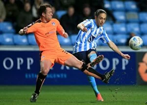 Images Dated 29th March 2016: Jodi Jones of Coventry City Crossing Under Pressure from Nicky Shorey of Colchester United in Sky