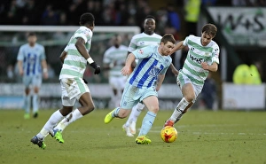 John Fleck Evades Pressure from Nathan Smith and Sam Foley in Coventry City's Sky Bet League One Clash at Huish Park