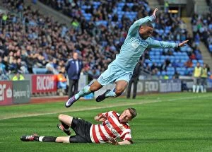 Images Dated 21st April 2012: Jordan Clarke Foul by James Husband: Coventry City vs Doncaster Rovers (April 2012)