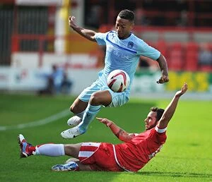 Pre Season Friendly - Accrington Stanley v Coventry City - Crown Ground Collection: Jordan Clarke Soars Above Lee Moleneux in Coventry City's Pre-Season Clash at Crown Ground