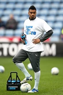 Images Dated 7th April 2012: Jordan Willis Pre-Match Warm-Up: Know the Score T-shirt at Ricoh Arena (Coventry City vs)