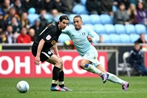 Images Dated 7th April 2012: Jordon Clarke Outsmarts George Boyd: Coventry City vs. Peterborough United in Npower Championship