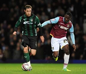 Images Dated 2nd January 2012: Keogh vs Nouble: Coventry City vs West Ham United - Npower Championship Showdown at Upton Park