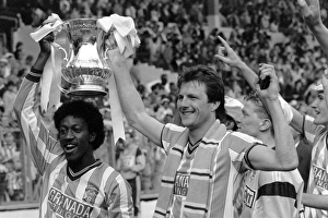 Trending: (L-R) Coventry Citys goalscorers Dave Bennett and Keith Houchen celebrate with the FA Cup after their 3-2 victory