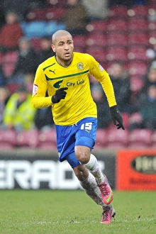 Images Dated 2013 March: Leon Clarke Leads Coventry City at Glanford Park Against Scunthorpe United in Football League One
