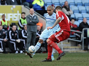 Images Dated 2013: Leon Clarke vs Aden Flint: Intense Rivalry in Coventry City vs Swindon Town League One Clash at Ricoh Arena