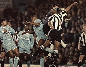 Les Ferdinand Leaps for the Ball: Coventry City vs. Newcastle United