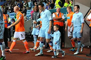 Lukas Jutkiewicz and Mascot Leading Coventry City Out at Ricoh Arena vs Blackpool (Npower Football League Championship, 27-09-2011)